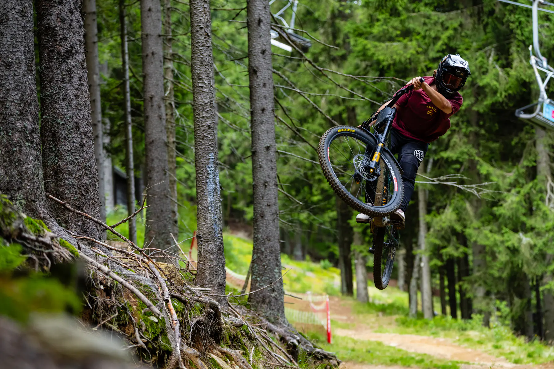 Mountain biker jumping on a forest trail